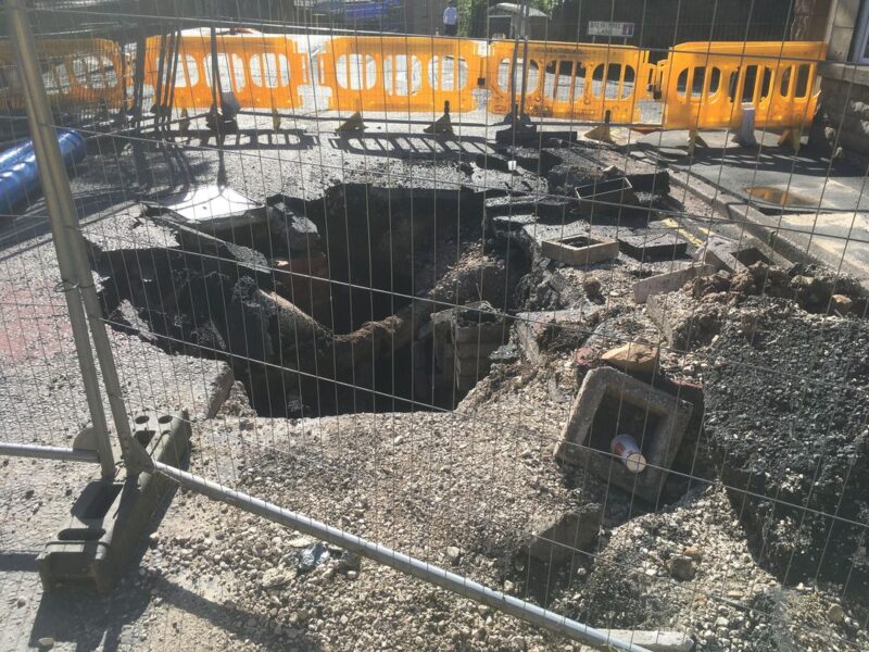 Moor Gate road collapse and exposed water pipe